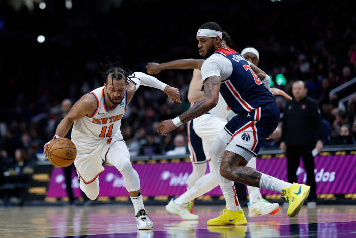 Jan 6, 2024; Washington, District of Columbia, USA; New York Knicks guard Jalen Brunson (11) drives to the basket as Washington Wizards center Daniel Gafford (21) defends in the second quarter at Capital One Arena. Mandatory Credit: Geoff Burke-USA TODAY Sports